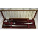 Cased pistol handled Sheffield carving set