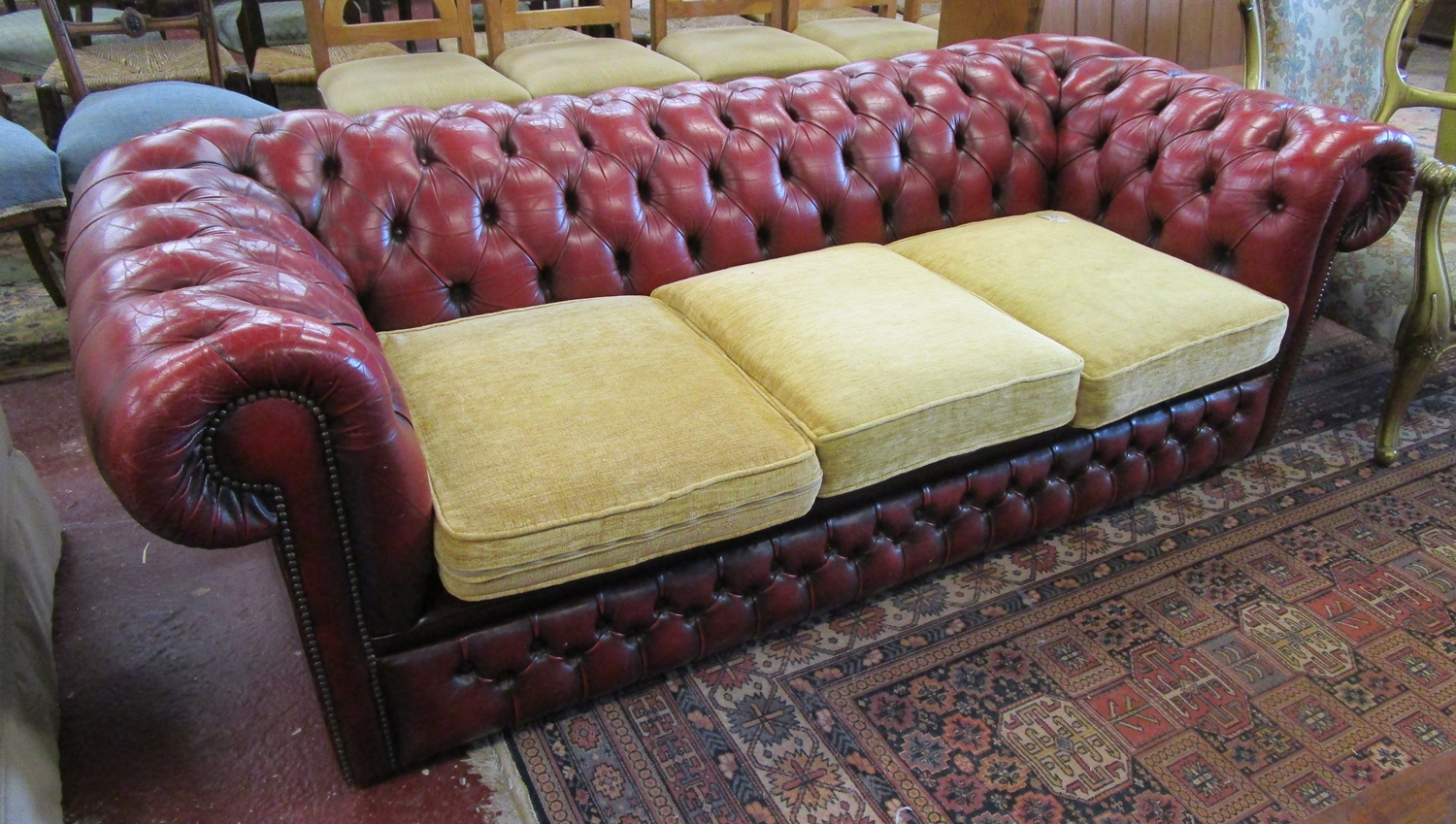Ox-blood button-back leather chesterfield