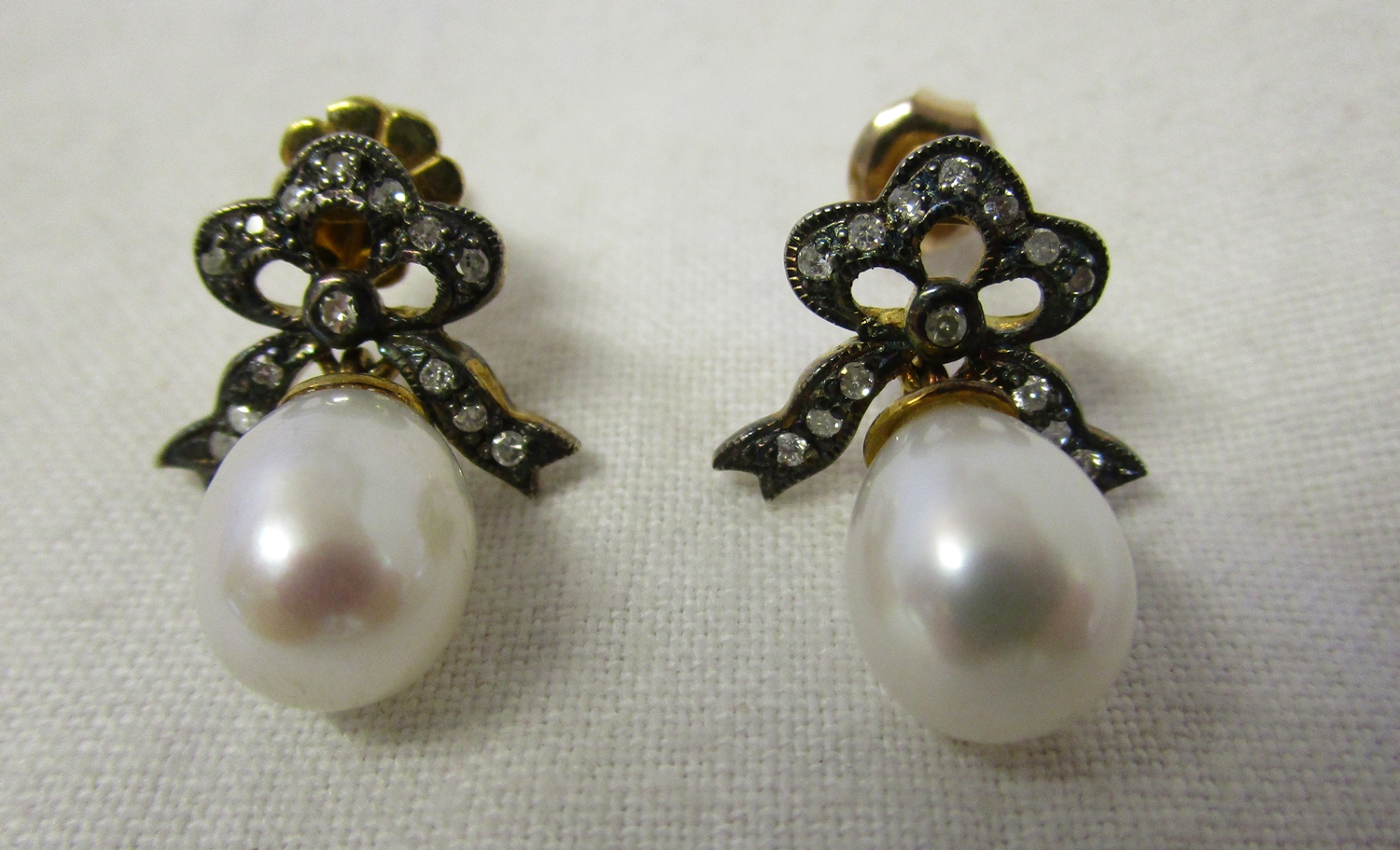 Pair of pearl and diamond earrings