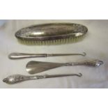 Collection of white metal to include hallmarked silver brush, button hooks etc
