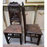 Pair of carved oak chairs depicting figures