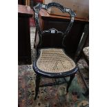 Ebony bergère seated chair inlaid with mother of pearl