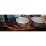 2 metal cooking pots and 2 heavy cast pans