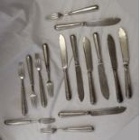 8 hallmarked silver forks, 7 hallmarked silver knives and 1 white metal knife in a similar style