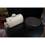 Ceramic hot water bottle and interesting biscuit tin