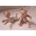 2 Continental porcelain piano babies