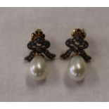Pair of pearl & diamond bow shaped earrings