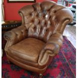 Vintage leather button-back armchair