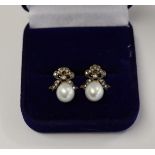 Pair of pearl & diamond bow topped earrings