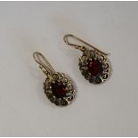 Pair of garnet gold earrings