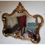 Ornate gilt framed wall mirror