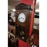 Edwardian oak wall clock