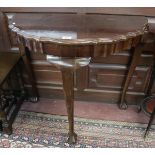 Demi lune mahogany hall table with pie crust edge