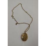 Large gold locket on chain