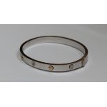 18ct white gold bangle set with three round cut brilliant diamonds, Approx weight 26.4gm