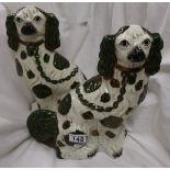 Pair of early Victorian Staffordshire dogs