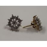 Pair of gold diamond set earrings