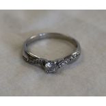 Platinum diamond solitaire ring with diamond shoulders