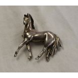 Heavy silver horse brooch