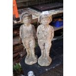 Pair of stone boy figures