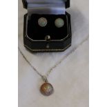 Ethiopian opal pendant on chain and pair of Ethiopian opal earrings