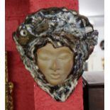 Majolica wall pocket depicting woman's face