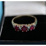 Gold ruby & diamond set ring