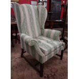 Upholstered wing-back armchair