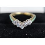Good 18ct diamond set wishbone ring