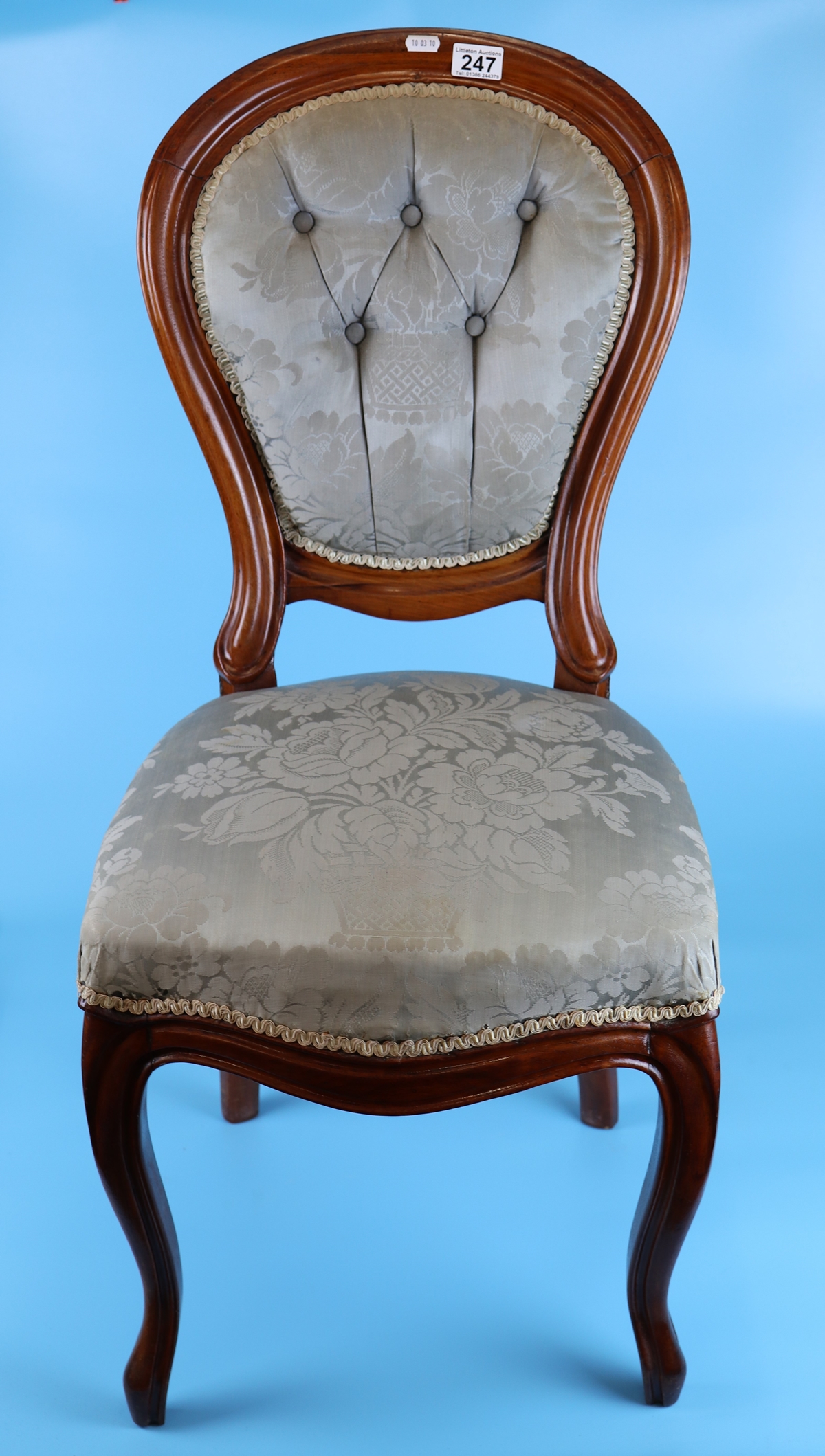 Upholstered balloon-back chair