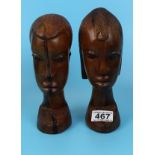 2 carved tribal heads