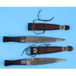 Pair of antique knives in leather sheaths