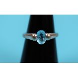 White gold blue topaz set ring