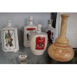 5 ceramic advertising decanters to include Masons & Wedgwood