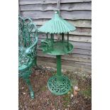 Green metal bird feeder