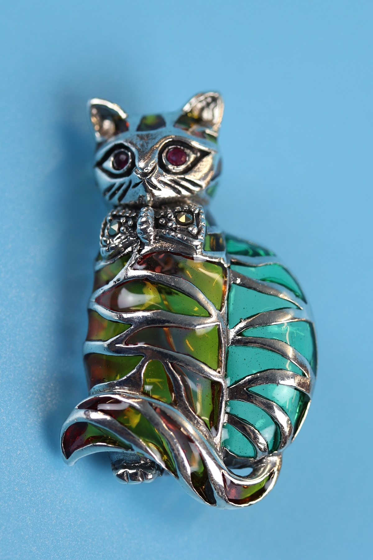 Silver, champlevé enamel & ruby eyed cat brooch