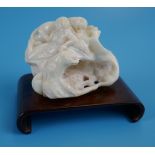 Carved white opal figure depicting lady & lion