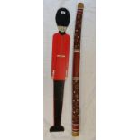 Didgeridoo & soldier measuring wall figure