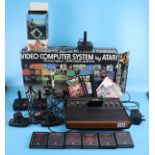 Atari CX-2600 in original box to include 7 games and original booklets, 3 joy sticks & 2 paddles