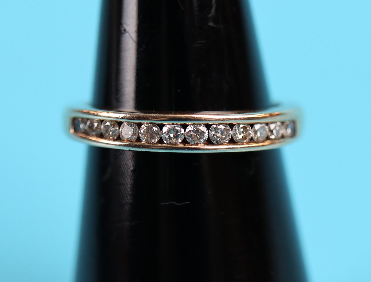 Gold channel set diamond ring