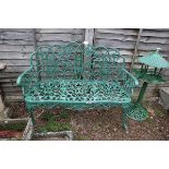 Green metal garden bench