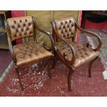 Pair of scroll arm leather button-back armchairs