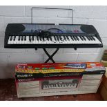 Electronic keyboard by Casio with stand
