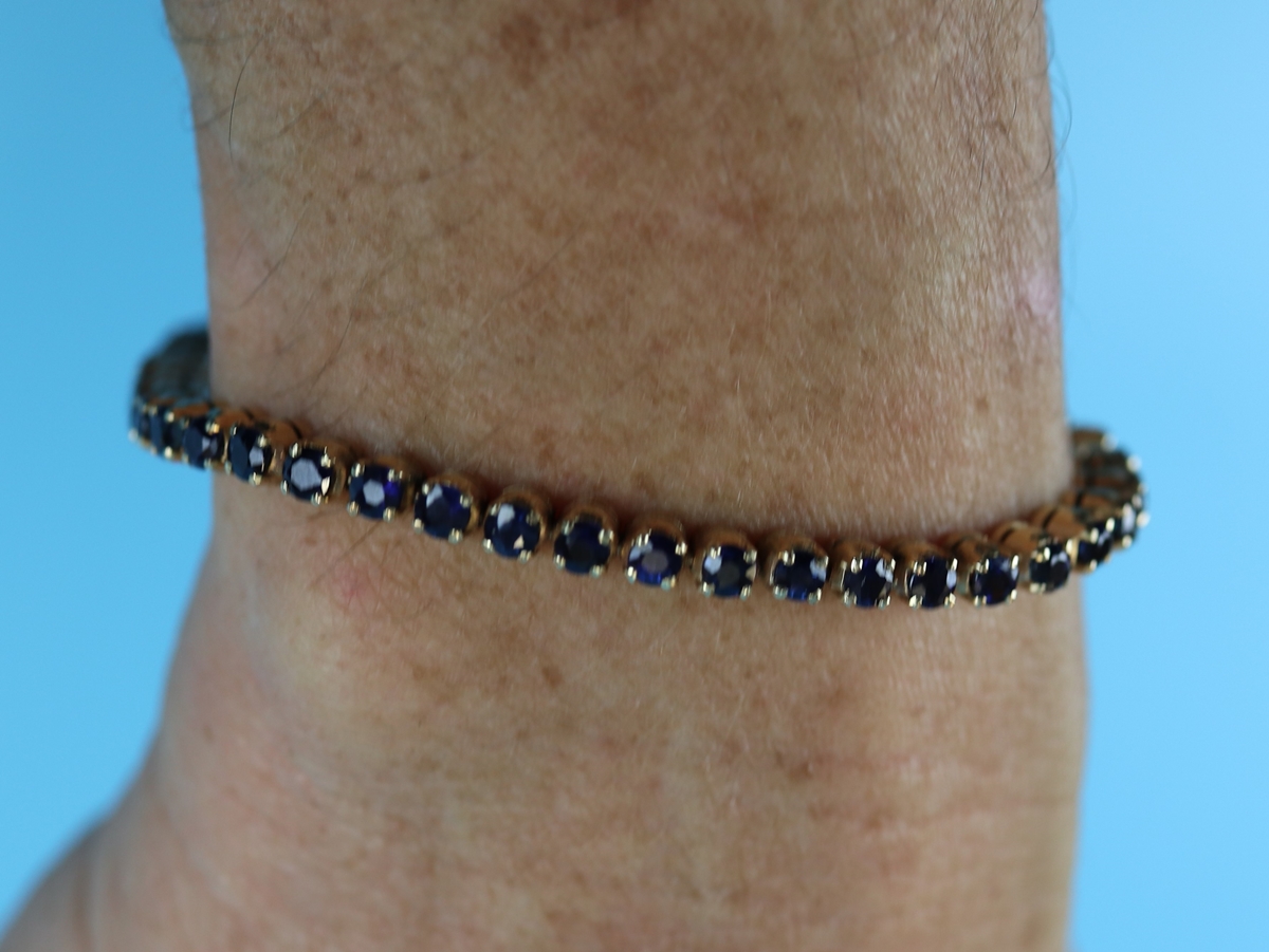 Gold sapphire set bracelet with valuation certificate