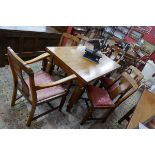 Art Deco walnut draw-leaf table and 6 matching chairs to include 2 carvers