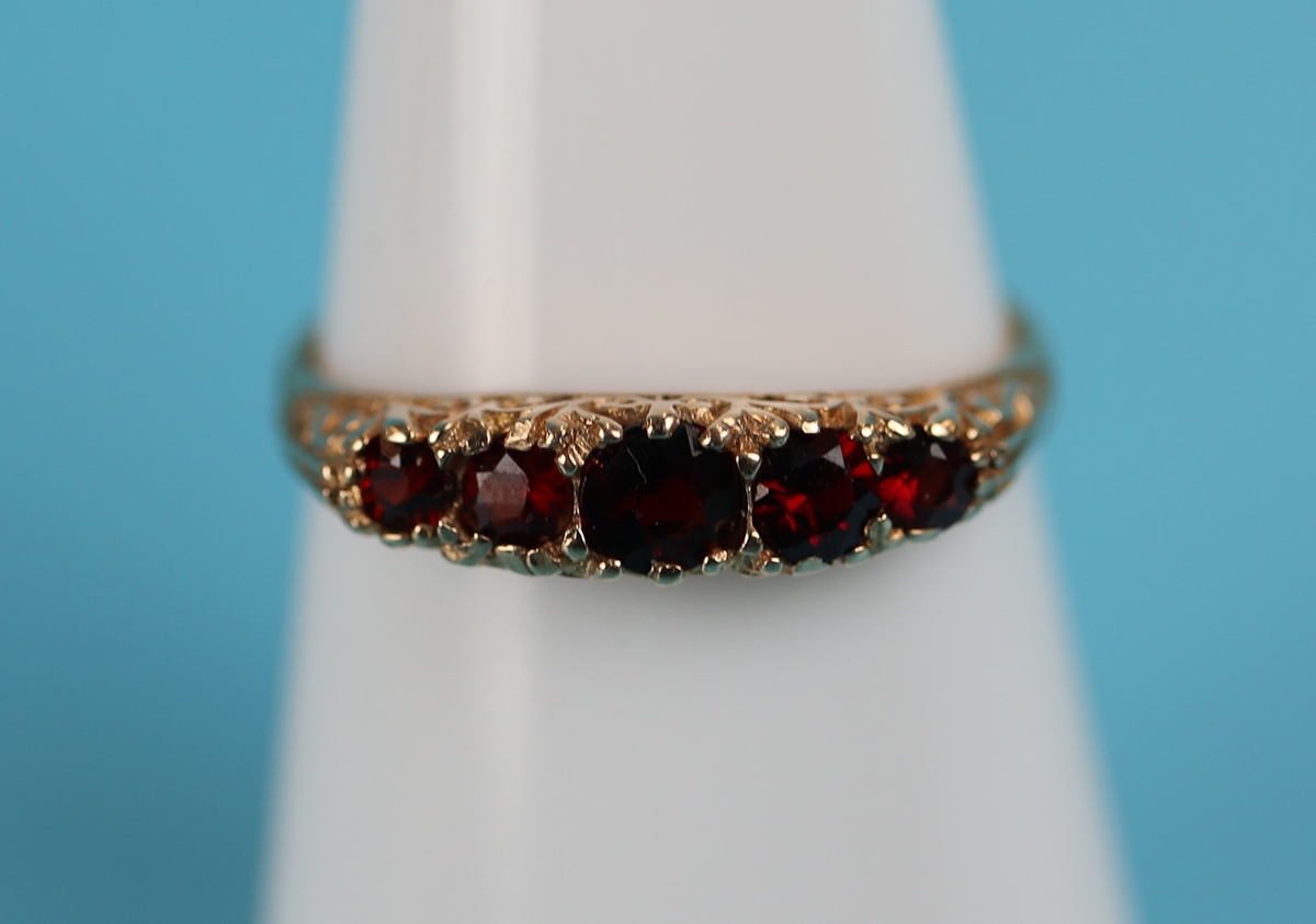 Gold 5 stone set garnet ring