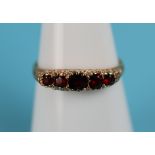 Gold 5 stone set garnet ring