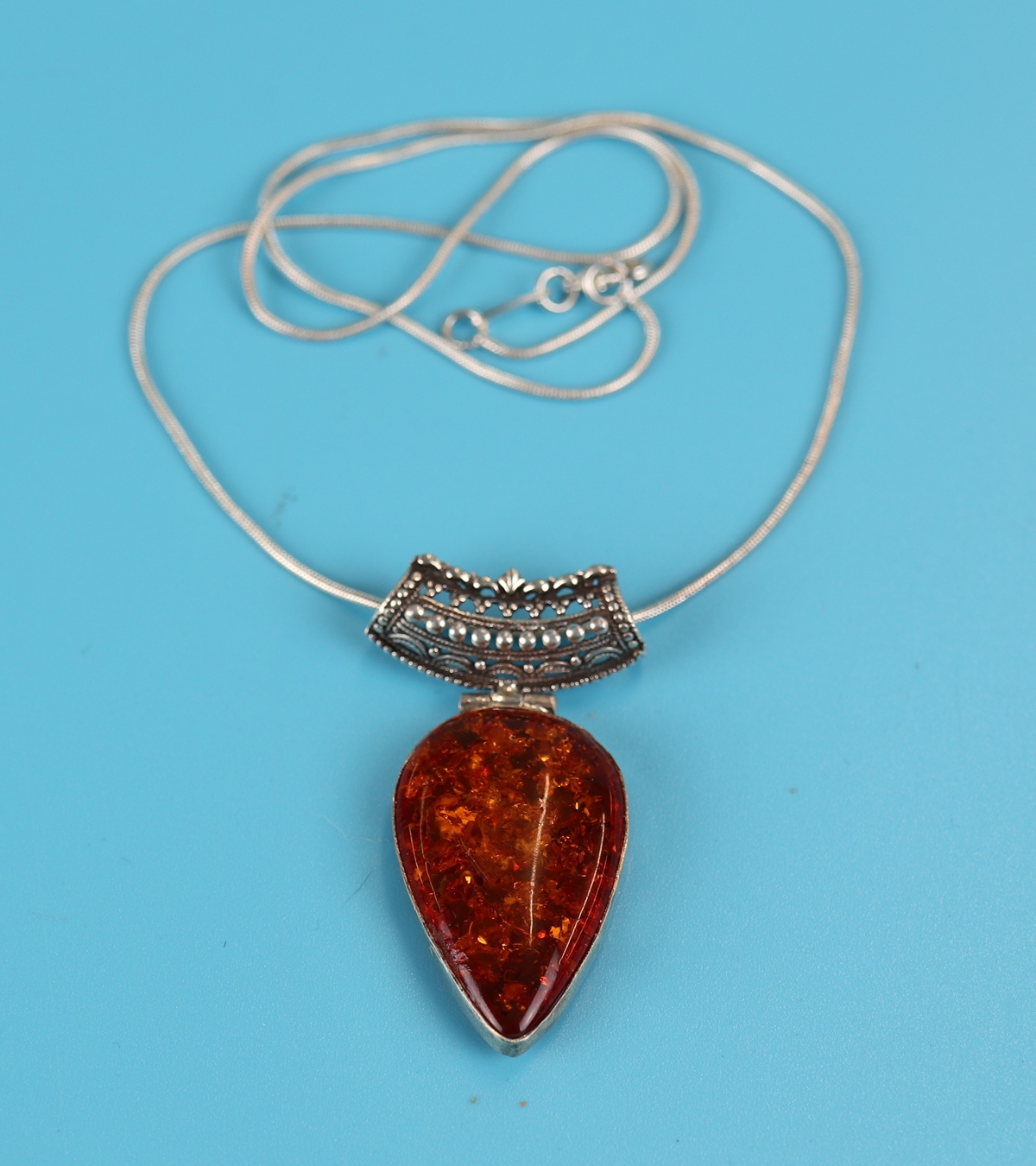 Silver & amber pendant on chain