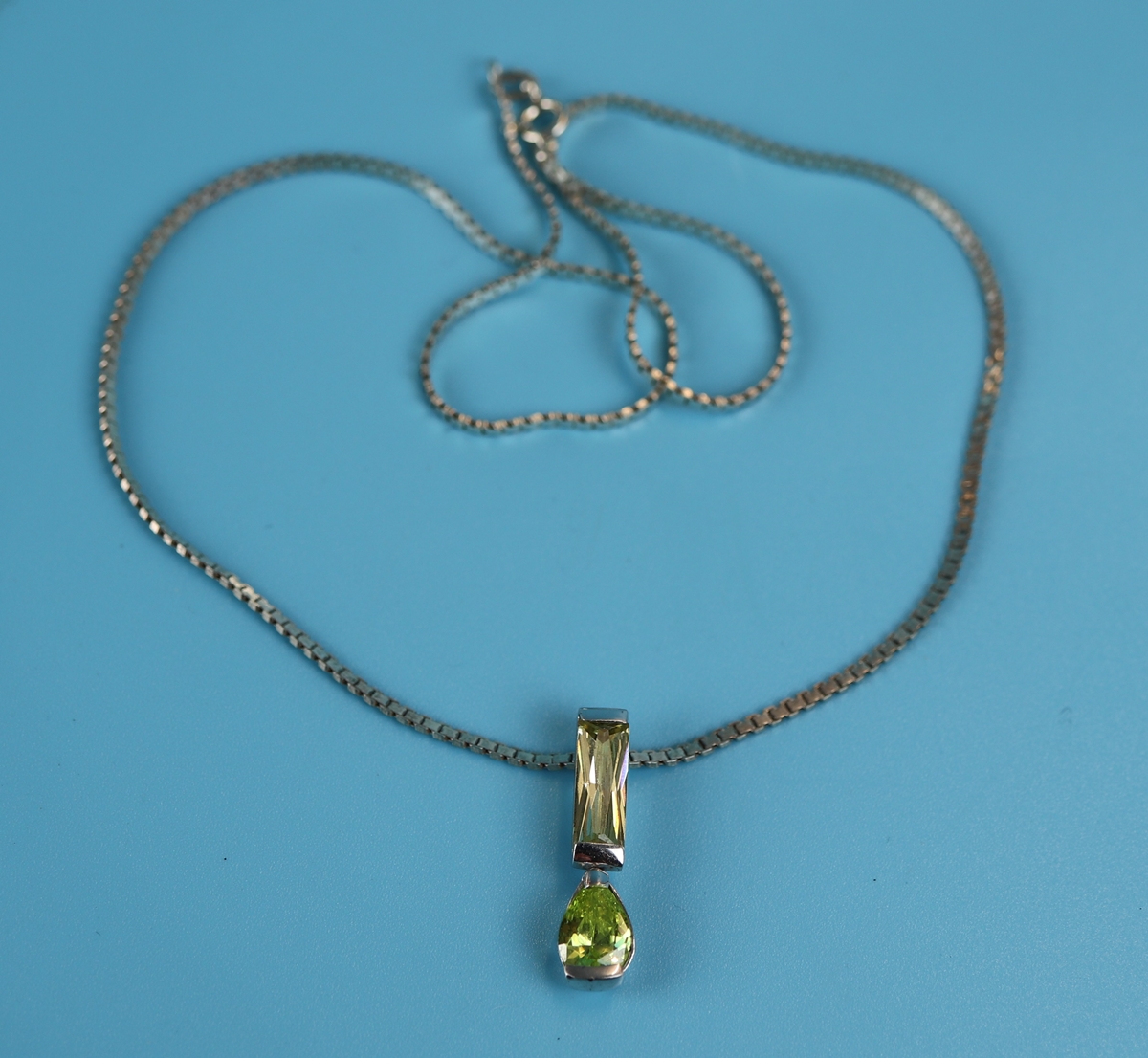 Silver stone set pendant on chain