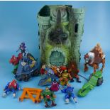He-Man action figures together with Castle Grayskull